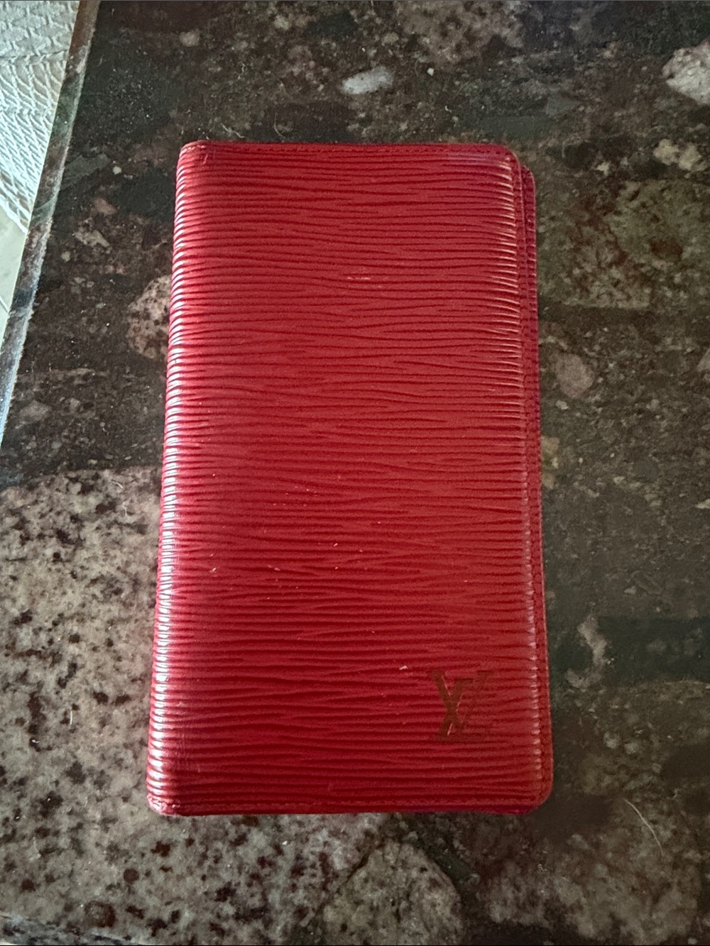 Authentic Louis Vuitton Epi Leather Red Wallet/billfold with slots for cards.